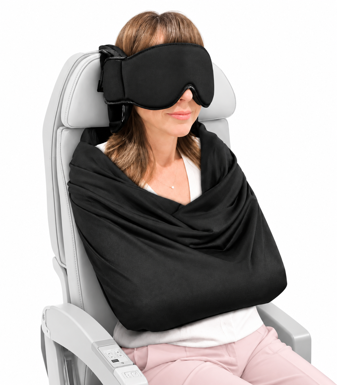 Woman sleeping on a plane with the NestAway mask strapped to the headrest